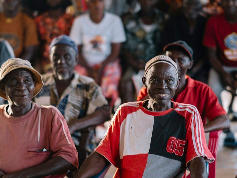Elderly people gathered and smiling